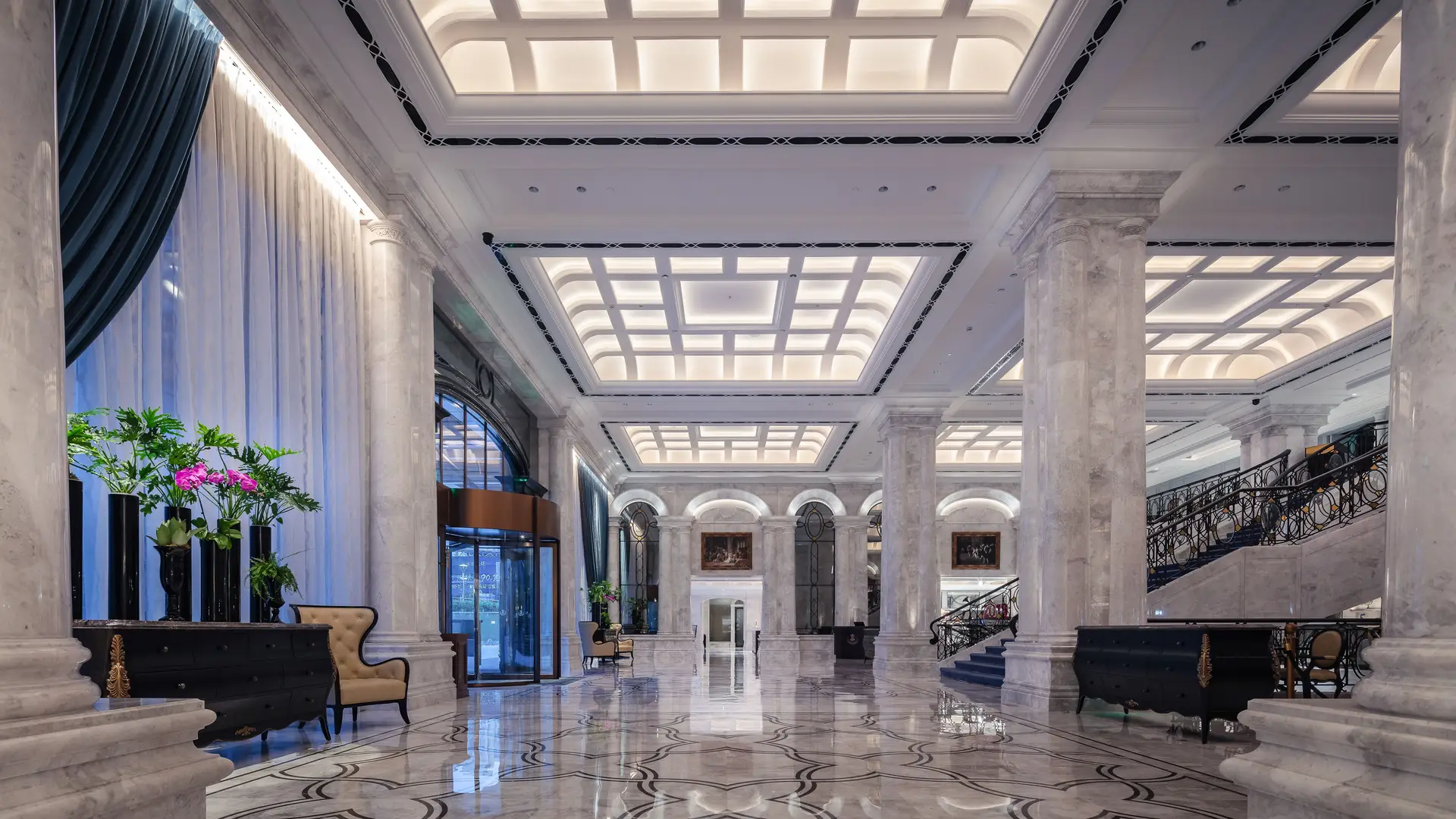 Elegant hotel lobby with marble columns and sophisticated lighting